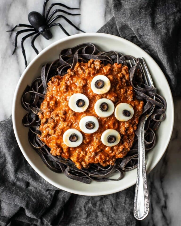 Halloween Pasta with Squid Ink Noodles, Spooky Beef Ragu, and Mozzhead “Eyeballs Recipe