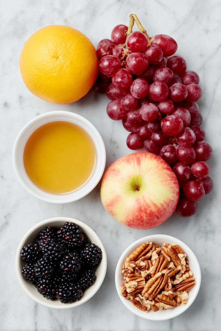 Fall Fruit Salad with Orange Maple Cinnamon Dressing, fall fruit salad, orange maple cinnamon dressing, seasonal fruit salad, easy fall fruit salad - Flat lay of a whole bright orange, a small white ceramic bowl filled with amber maple syrup, a small white ceramic bowl containing fine ground cinnamon powder, a bunch of fresh red seedless grapes, a cluster of plump blackberries, a small white ceramic bowl with chopped pecans, two whole crisp sweet apples (one red and one with a blush yellow tone) placed beside each other, all arranged in perfect symmetry on a clean white marble surface, soft natural light, photo taken with an iPhone, professional food photography style, fresh ingredients, white ceramic bowls, no bottles, no duplicates, no utensils, no packaging --ar 2:3 --v 7 --p awthu7i m7354615311229779997
