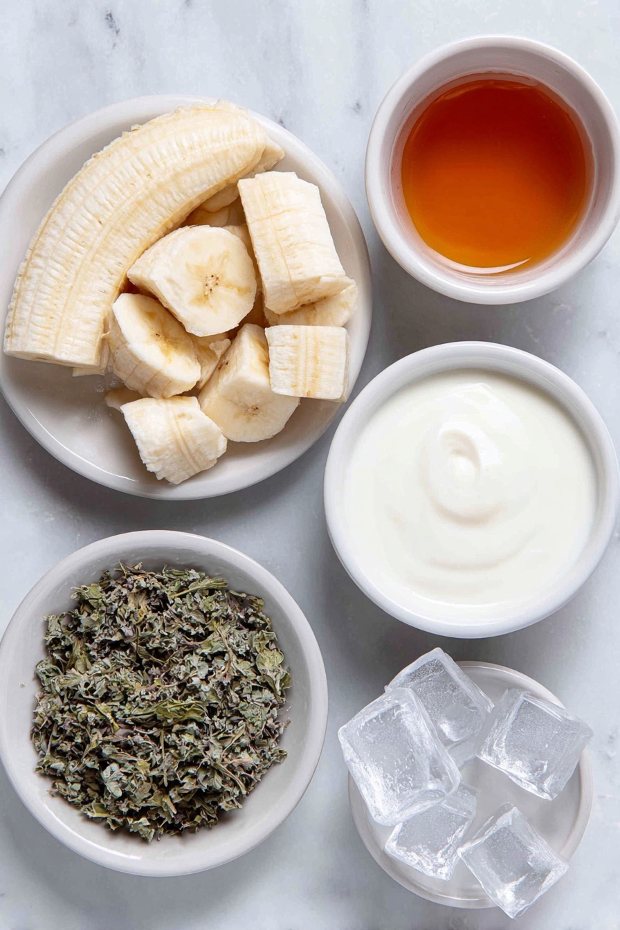 Banana Chamomile Tea Smoothie, soothing banana smoothie, chamomile tea drink, healthy fruit smoothie, calming beverage recipes - Flat lay of a peeled ripe banana broken into chunks, a small white bowl of brewed chamomile tea, a small white bowl of honey, a small white bowl of fresh milk, a few clear ice cubes arranged neatly, and a small white bowl with dried chamomile leaves for garnish, all placed in perfect symmetry on simple white ceramic dishes, placed on a clean white marble surface, soft natural light, photo taken with an iPhone, professional food photography style, fresh ingredients, white ceramic bowls, no bottles, no duplicates, no utensils, no packaging --ar 2:3 --v 7 --p awthu7i m7354615311229779997
