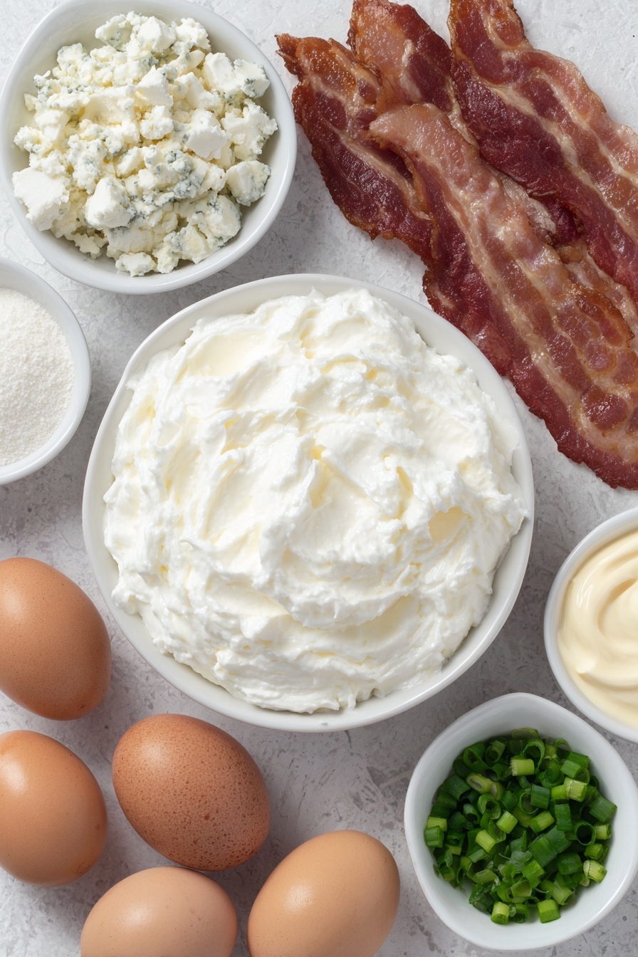 Baked Bacon Blue Cheese Dip, bacon blue cheese dip, blue cheese bacon dip, party dip recipes, creamy blue cheese dip - Flat lay of softened cream cheese in a small white ceramic bowl, a small white bowl filled with creamy mayonnaise, a small white bowl with crumbled blue cheese, a few whole uncracked brown eggs, several crispy cooked bacon slices without packaging, a small white bowl of garlic powder, and a small white bowl of freshly chopped green onions placed in perfect symmetry, all ingredients fresh and natural, no duplicates, no utensils, no packaging, no bottles --ar 2:3 --v 7 --p m7354615311229779997