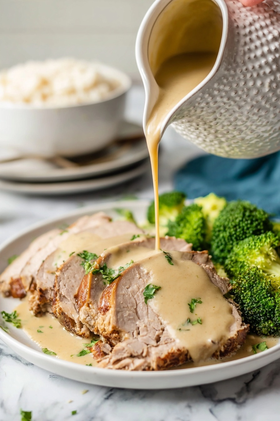 Crock Pot Pork Roast with Easy Gravy, slow cooker pork roast recipe, tender pork roast with gravy, easy crock pot dinner ideas, flavorful pork roast - A white plate holds several slices of light brown cooked meat with a slightly darker crust on the edges, arranged in a neat row. A woman's hand pours a thick, creamy beige sauce over the center slices, creating a smooth layer that drapes over the meat. Bright green parsley pieces are scattered on top, adding color contrast. On the side of the plate, vibrant green broccoli florets add freshness to the dish. The scene is set on a white marbled surface, and in the background, a white textured pitcher is seen pouring the sauce, with a white bowl filled with rice and a stack of white plates slightly blurred. photo taken with an iphone --ar 2:3 --v 7